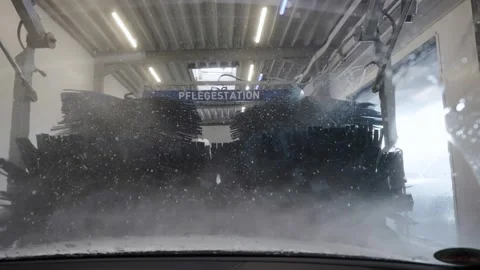 Car going through an automated car wash machine, slow motion Stock Footage 246624606