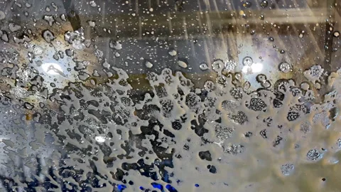 Car going through a car wash from drivers point of view Stock Footage 328363643