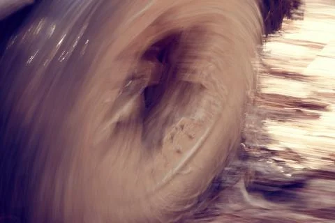 The car got stuck in the mud. View of a wheel spinning in the mud Stock Photos