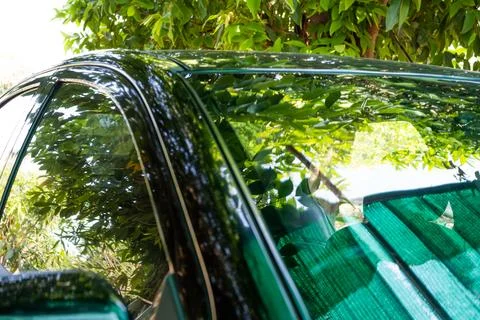 A car with a green cloth on the windshield Stock Photos