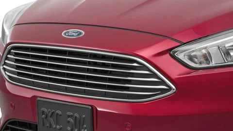 Car grille close up Ruby Red Tinted Clearcoat 2016 Ford Focus Titanium Stock Footage 159865997