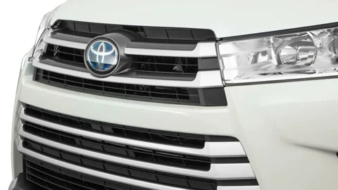 Car grille with emblem close up Blizzard Pearl 2017 Toyota Highlander Hybrid XLE Stock Footage 159928126