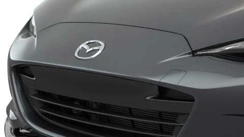 Car grille with emblem close up Meteor Gray Mica 2017 Mazda MX-5 Miata Club Stock Footage 159945605