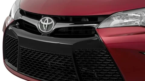 Car grille with emblem close up Ruby Flare Pearl 2016 Toyota Camry XSE Stock Footage 159851729