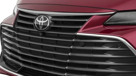 Car grille with emblem close up Ruby Flare Pearl 2019 Toyota Avalon Limited Stock Footage 160076171