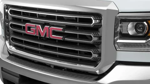 Car grille with emblem close up Summit White 2016 GMC Sierra 2500HD SLE Stock Footage 159860871