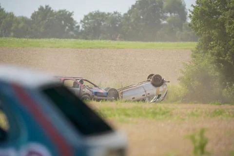 A car has crashed into a tree and is upside down Stock Photos