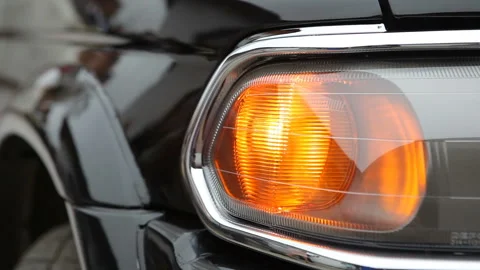 Car has an emergency stop, the yellow turn signal is flashing.  Stock Footage 158707867