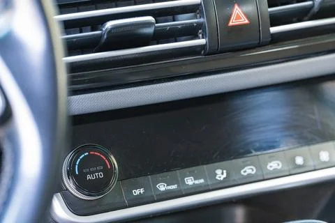 Car hazard warning lights button and air conditioning vent close up Fotos Stock
