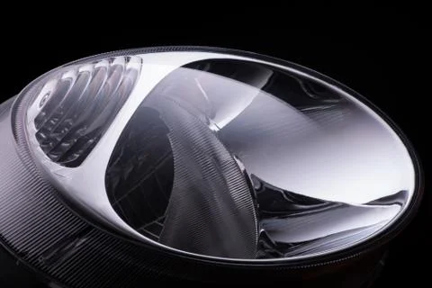 A car headlight on a black background Stock Photos