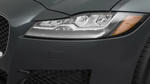 Car headlight close up Alpine White 2017 Jaguar XF 25t Premium Video stock 159916183