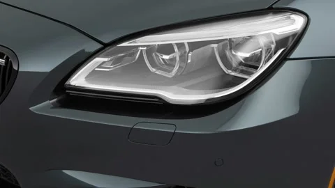Car headlight close up Atomic Silver 2017 BMW 6-series M6 Stock Footage 159939779