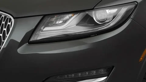 Car headlight close up Atomic Silver 2019 Lincoln MKC Select Stock Footage 160016925