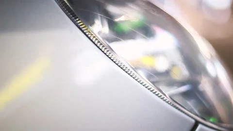 Car headlight close up in the evening Stock Footage 130737747