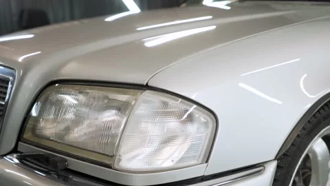 Car headlight close up. Front light with a white colour. Car headlight lamp. Stock Footage 186753313