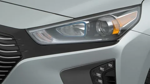 Car headlight close up Granite 2017 Hyundai Ioniq Hybrid SEL Stock Footage 159938047