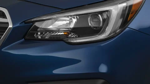 Car headlight close up Heritage Blue Pearl 2019 Subaru Legacy 2.5i Premium Stock Footage 160021682