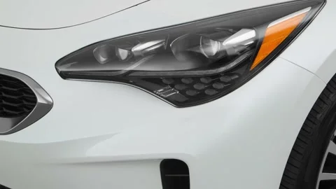 Car headlight close up Ingot Silver 2018 Kia Stinger Premium Stock Footage 160000815