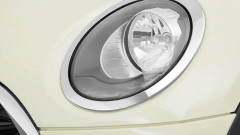 Car headlight close up Laser Blue Metallic 2016 Mini Clubman Cooper Stock Footage 159876494