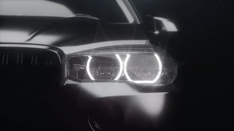 Car headlight in close-up with the light on, illuminated by dynamic light, fo Stock Footage 273474584