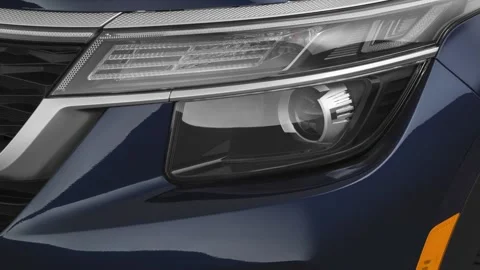 Car headlight close up Lunar Blue Metallic 2021 Kia Seltos EX CUV Stock Footage 160113022