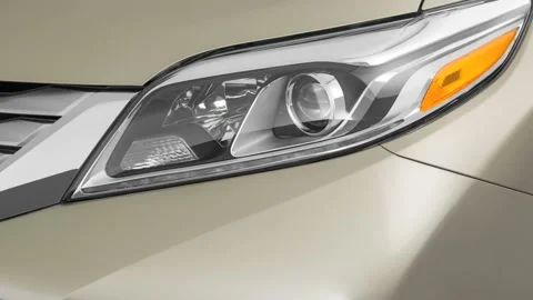 Car headlight close up Magnetic 2017 Toyota Sienna Limited Premium Stock Footage 159916632