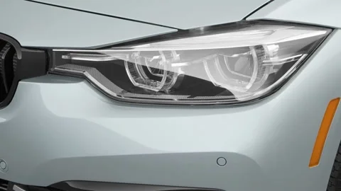 Car headlight close up Magnetic Metallic 2017 BMW 3-series 328d Stock Footage 159936795