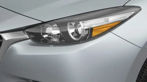 Car headlight close up Nardo Gray 2017 Mazda MAZDA3 Sport Stock-Footage 159914837