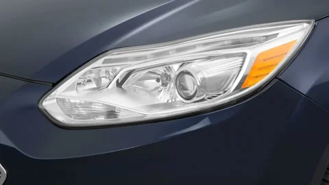 Car headlight close up Nebula Gray Pearl 2016 Ford Focus Electric SE Stock Footage 159854225
