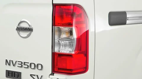 Car headlight close up Nightfall Gray Metallic 2016 Nissan NV3500 Passenger SV Stock Footage 159899754