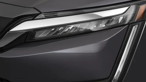 Car headlight close up Pomegranate Red 2017 Honda Clarity Electric SE Stock Footage 159978573