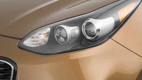 Car headlight close up Reflex Silver Metallic 2017 Kia Sportage SX Turbo Stock Footage 159885915