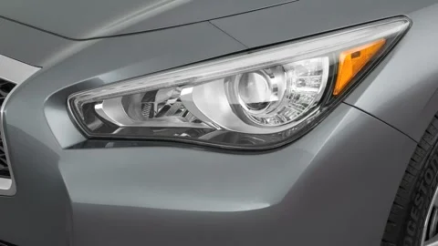 Car headlight close up Summit White 2016 Infiniti Q50 2.0t Premium Stock Footage 159887408