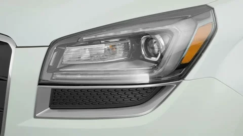 Car headlight close up Summit White 2017 GMC Acadia Limited  Limited Video stock 159900636