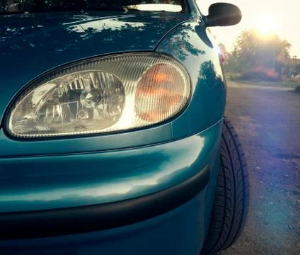 Car headlight close-up. Turn, stop and reverse signals on sunset Stock Photos