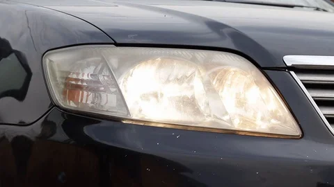 Car headlight flashing close up Stock Footage 129137427