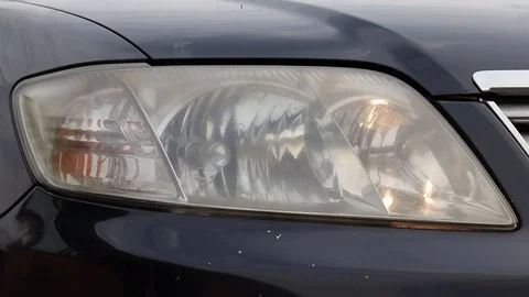 Car headlight flashing close up Stock Footage 129696558