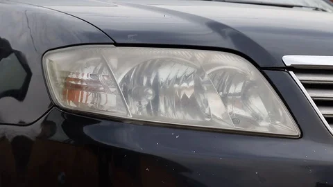 Car headlight flashing close up Stock Footage 129697730