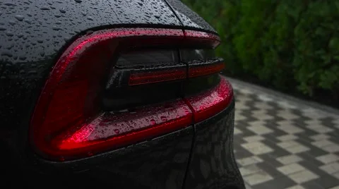 Car headlight flashing in the rain Stock Footage 68566334