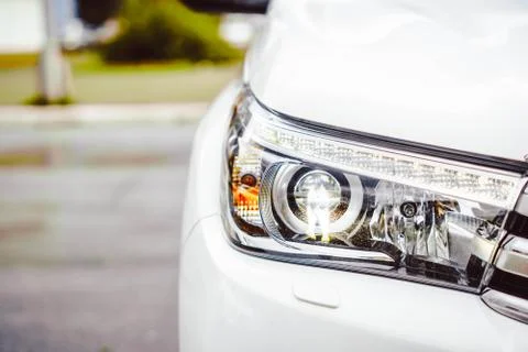 Car headlight in front Stock Photos