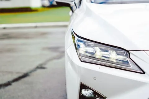 Car headlight in front Stock Photos