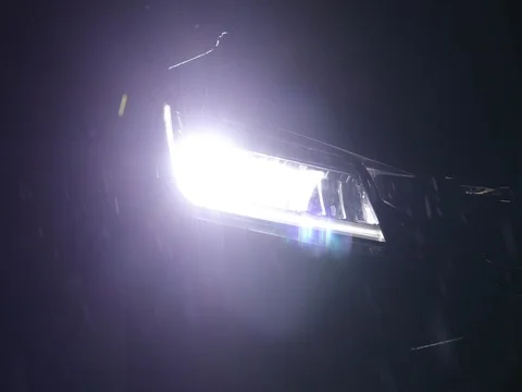 Car headlight on rainy night Stock Footage 85078593