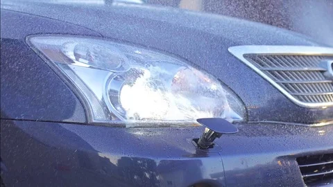 Car headlight washer system in its work Stock Footage 73853804