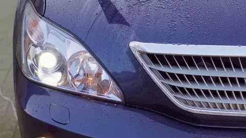 Car headlight washer system in its work Stock Footage 74771692