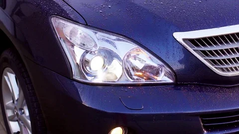 Car headlight washer system in its work Stock Footage 74873241