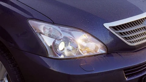 Car headlight washer system in its work Stock Footage 74915771