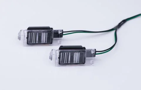 A car headlight on white background with reflection Stock Photos