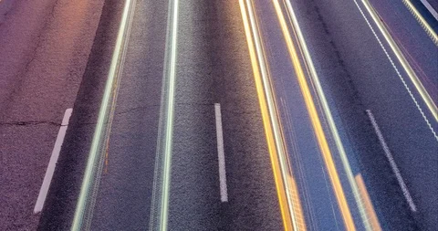 Car headlights on the background of asphalt highway with road markings Stock Footage 106134039