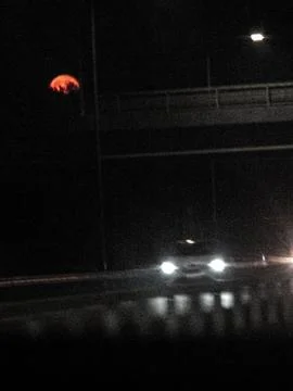Car headlights on a bridge at night Stock Photos
