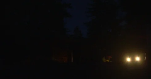 Car headlights coming towards camera. Stock Footage 88370040